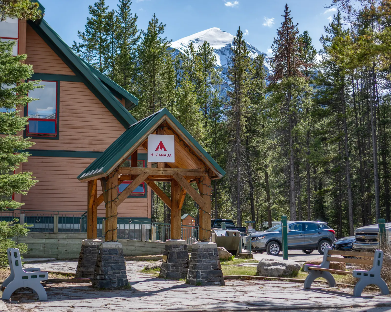 Entrance sign and timber facade at the HI Lake Louise Alpine Centre.