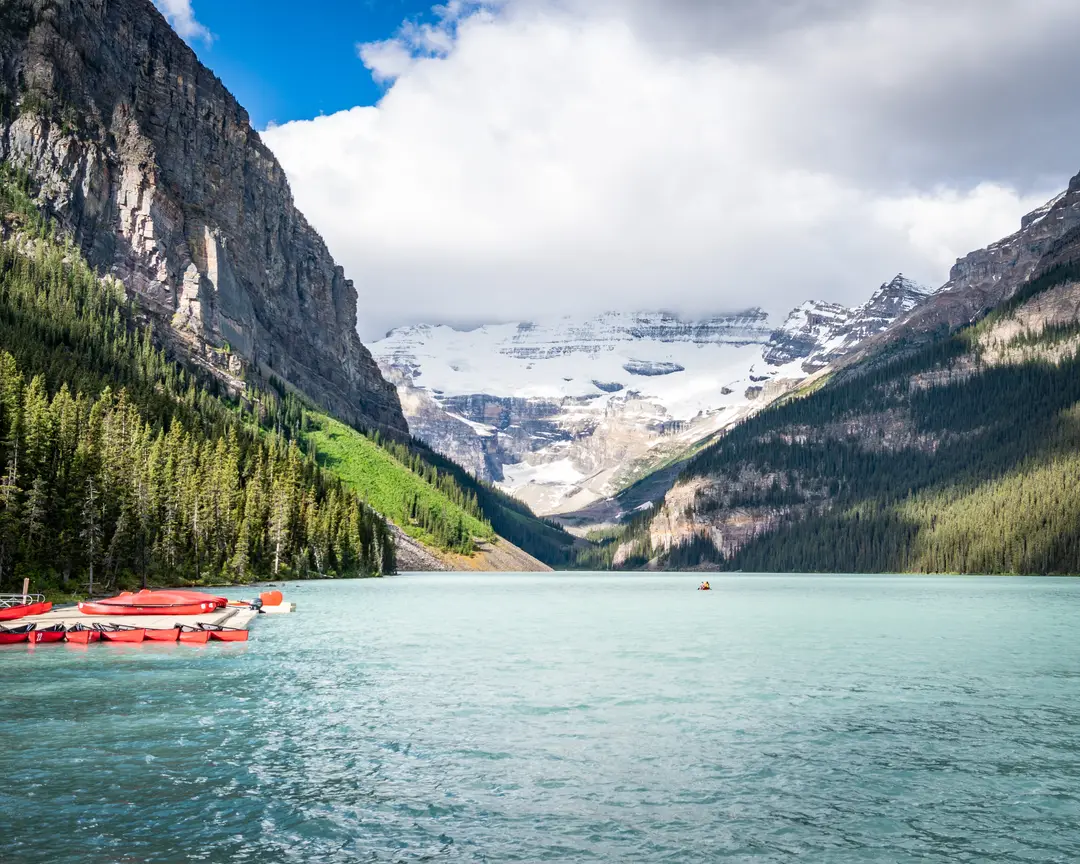 Canoes on Lake Louise beneath the Victoria Glacier on a late June morning.
